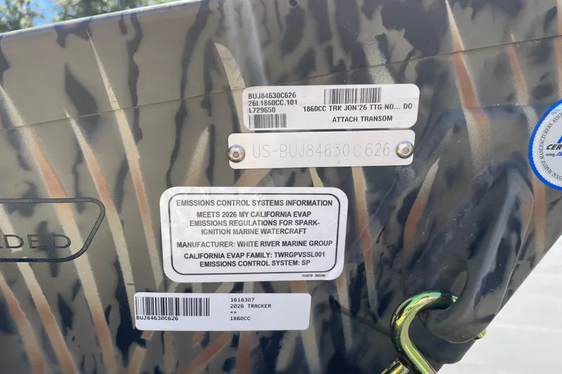 Slide: The Image of 2026 Tracker Grizzly 1860 CC boat with emissions control information and serial numbers. - 76