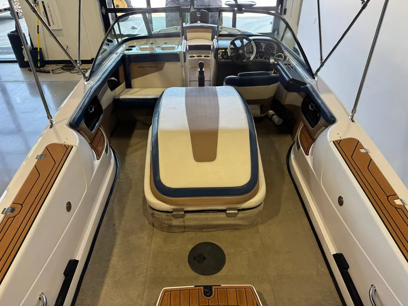Slide: The Image of Interior view of a 2010 Nautique Ski Nautique 200 with beige and brown seating. - 10