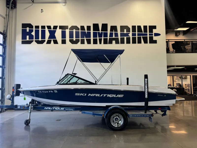 Slide: The Image of 2010 Nautique Ski Nautique 200 on a trailer inside a showroom. - 4