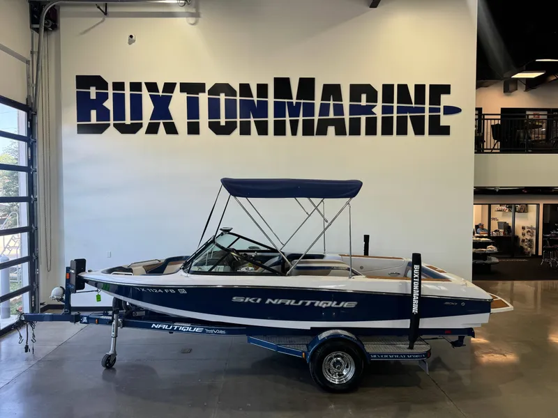 The Image of A 2010 Ski Nautique 200 boat is displayed in a showroom. - 1