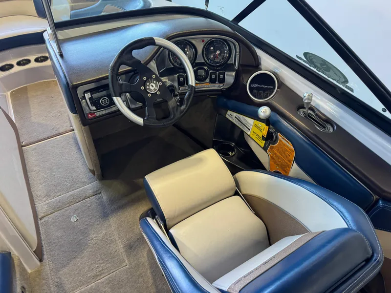 Slide: The Image of Interior view of a 2010 Nautique Ski Nautique 200 with steering wheel and dashboard. - 23