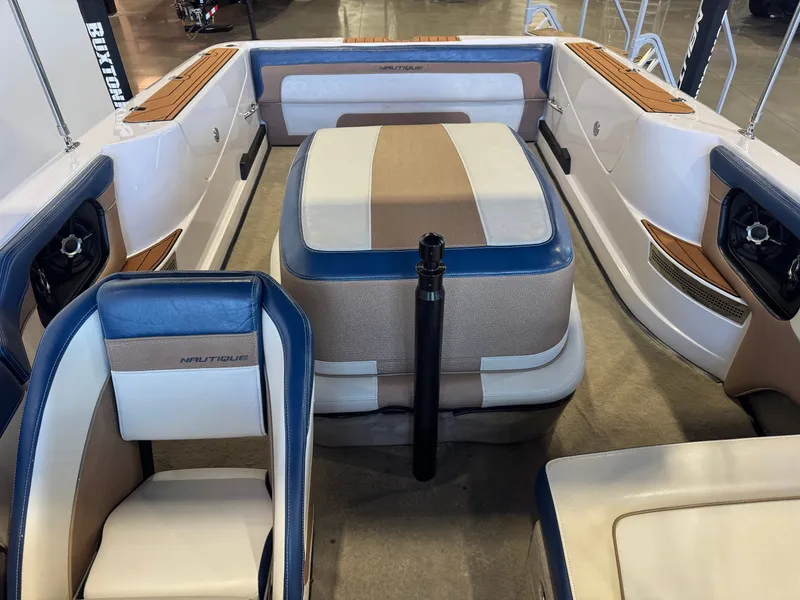 Slide: The Image of Interior view of a 2010 Nautique Ski Nautique 200 with blue and beige seating. - 20