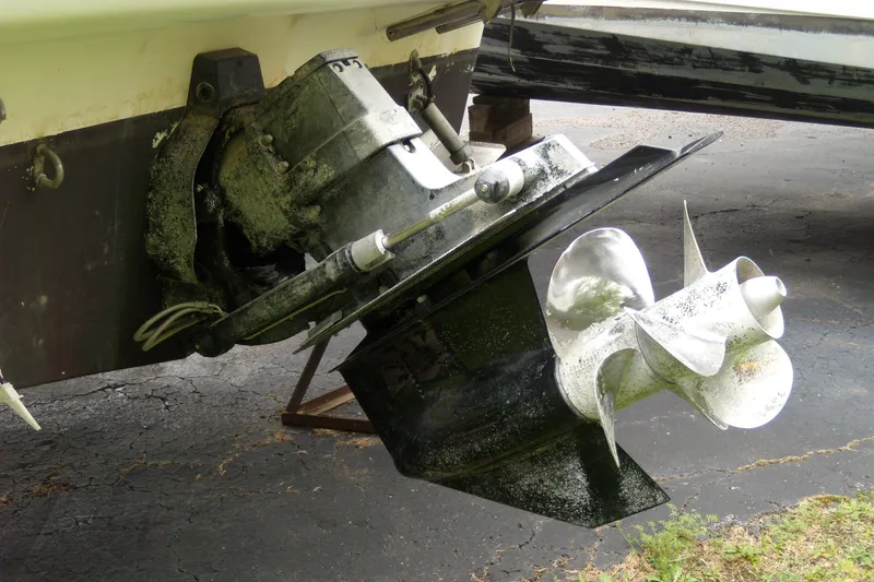 Slide: The Image of Close-up of a 2002 Bayliner 2455 Ciera boat propeller and outdrive. - 3