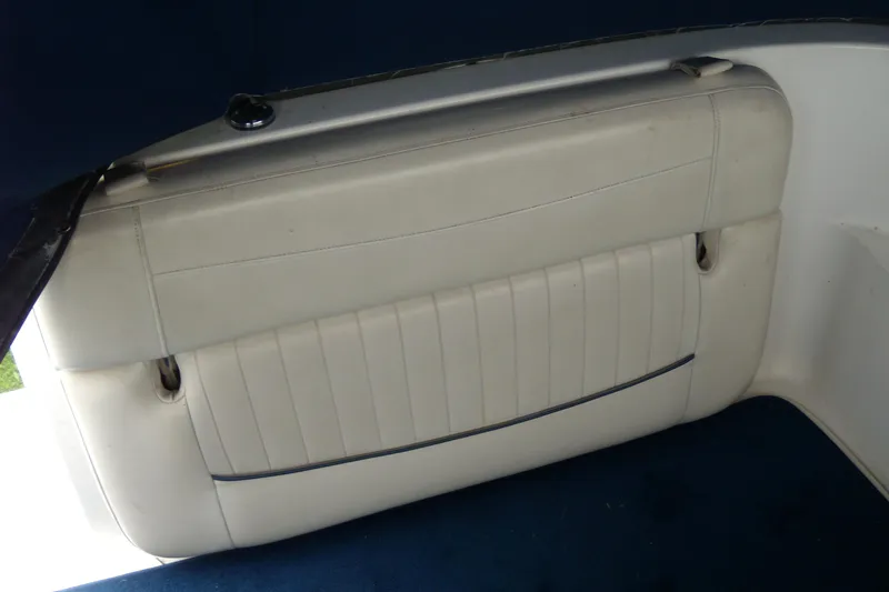 Slide: The Image of White leather seating on a 2002 Bayliner 2455 Ciera boat interior. - 6