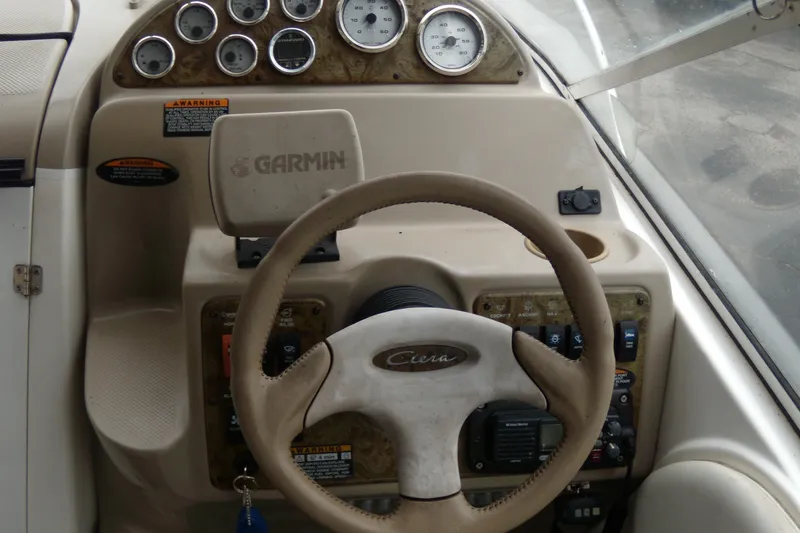 Slide: The Image of Steering console of a 2002 Bayliner 2455 Ciera boat with Garmin navigation system. - 5