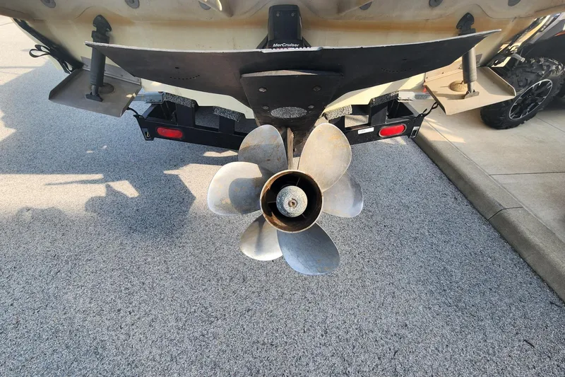Slide: The Image of Rear view of a 2003 Sea Ray 240 Sundancer boat propeller and trailer. - 9