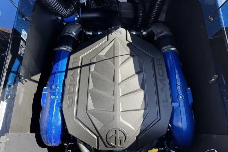 Slide: The Image of Engine of 2026 MasterCraft XT23 boat with Ilmor branding and blue components. - 3