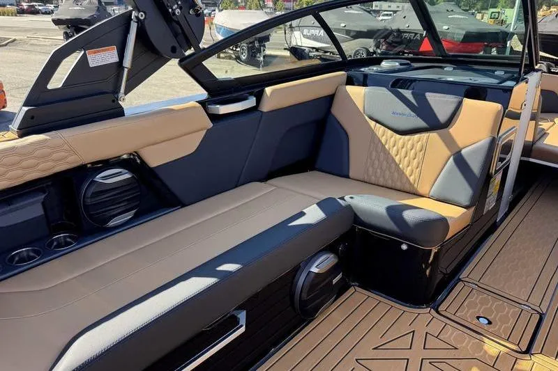 Slide: The Image of 2026 MasterCraft XT23 boat interior with luxurious seating and modern design. - 11