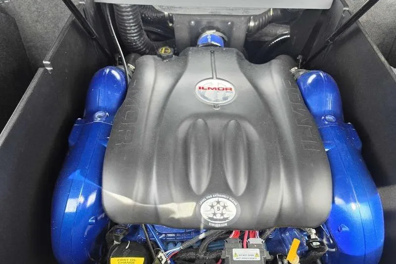 Slide: The Image of 2027 MasterCraft X23 Ilmor engine with blue accents in a sleek compartment. - 9