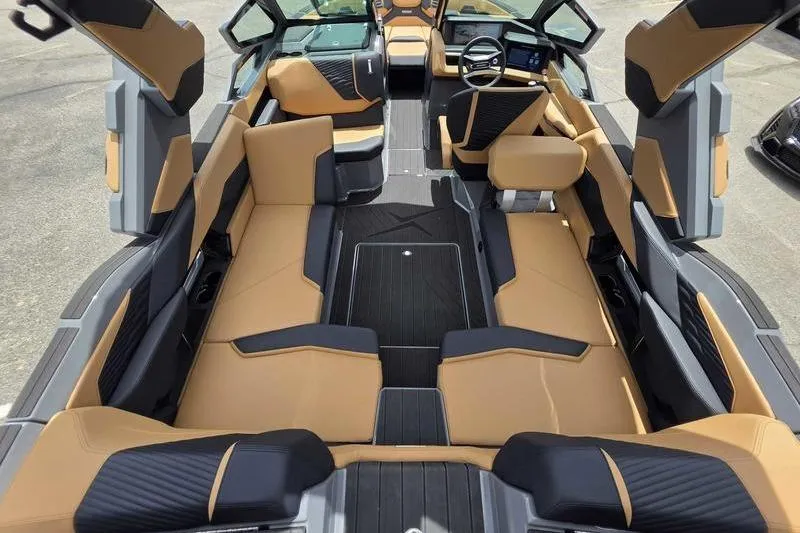 Slide: The Image of Luxurious interior of 2027 MasterCraft X23 boat with tan and black seating. - 6
