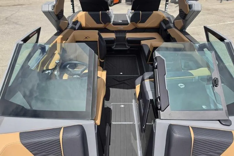 Slide: The Image of 2027 MasterCraft X23 boat interior with luxurious seating and modern design. - 4