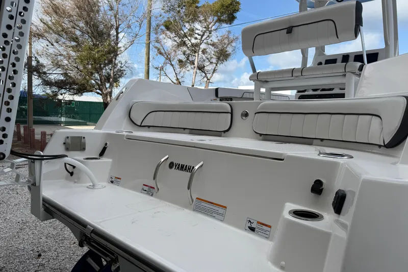 Slide: The Image of 2024 Yamaha Boats 222 FSH Sport E, rear seating and deck view. - 4