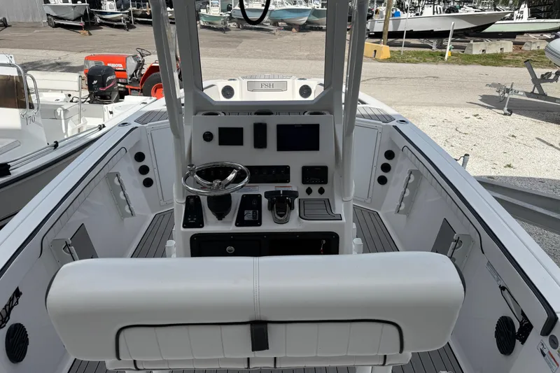 Slide: The Image of 2024 Yamaha Boats 222 FSH Sport E cockpit with modern controls and sleek design. - 6