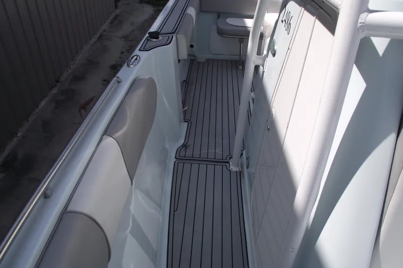 Slide: The Image of 2018 Caravell Key Largo 2486WI boat interior with sleek seating and modern design. - 14