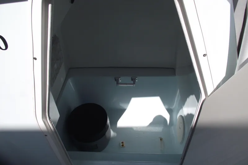 Slide: The Image of 2018 Caravell Key Largo 2486WI boat interior storage compartment. - 11