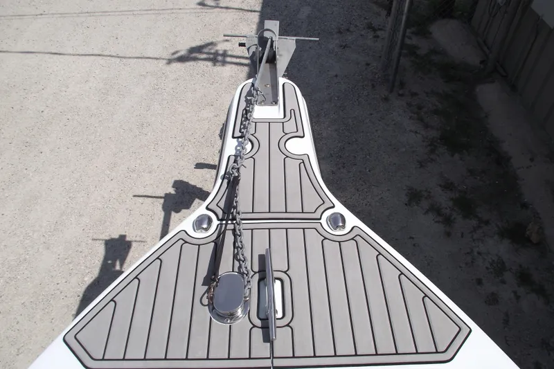 Slide: The Image of Bow view of 2018 Caravell Key Largo 2486WI boat with anchor chain and deck details. - 4