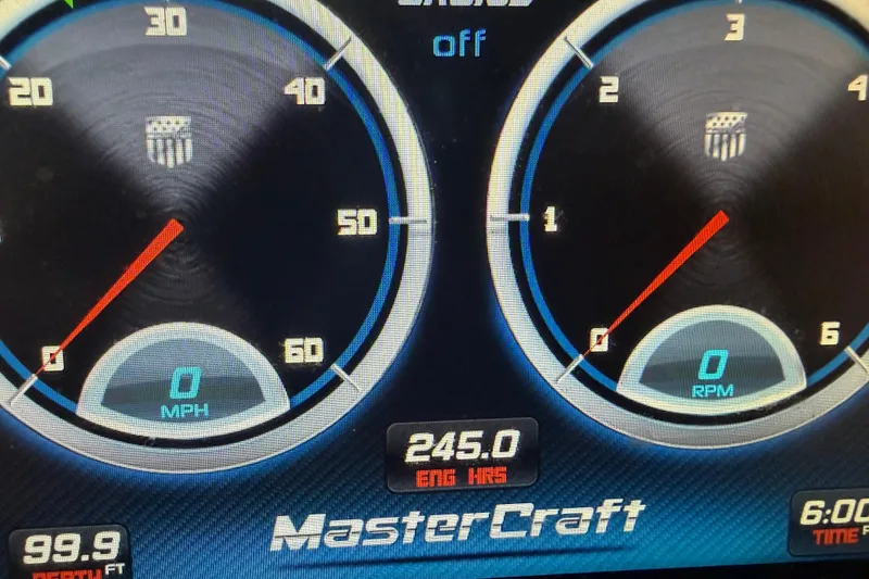 Slide: The Image of Dashboard of a 2013 MasterCraft XStar showing speed, RPM, engine hours, and depth. - 13