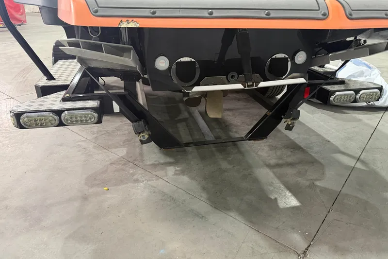 Slide: The Image of Rear view of a 2013 MasterCraft XStar boat with visible underwater lights. - 15