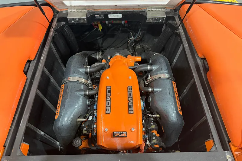Slide: The Image of 2013 MasterCraft XStar engine compartment with Ilmor MV8 7.4 engine, featuring orange accents. - 14