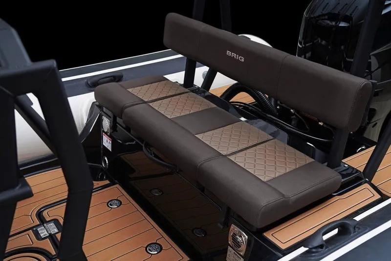 Slide: The Image of 2027 Brig Navigator 22 boat interior with cushioned seating and elegant design. - 7