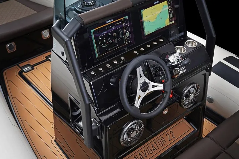 Slide: The Image of 2027 Brig Navigator 22 boat dashboard with advanced navigation and control systems. - 13