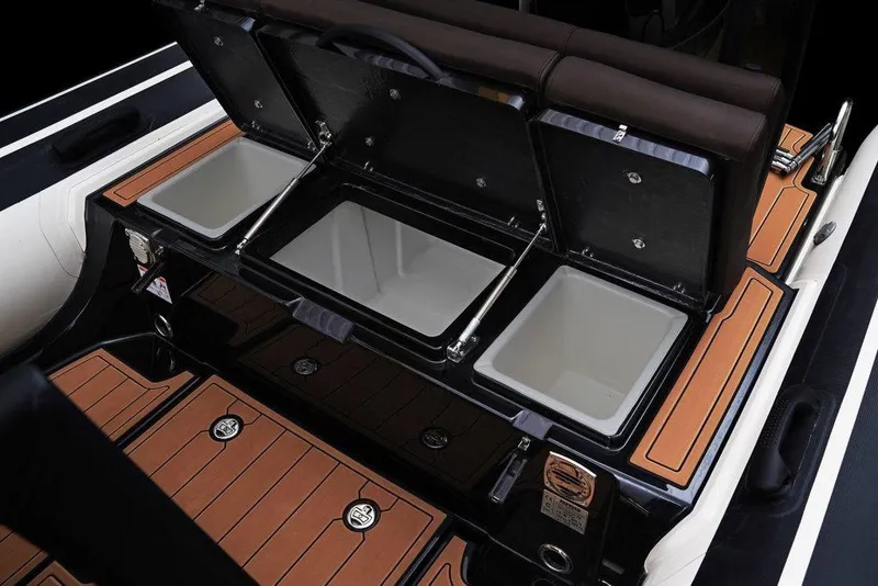 Slide: The Image of 2027 Brig Navigator 22 boat interior with open storage compartments and sleek design. - 6