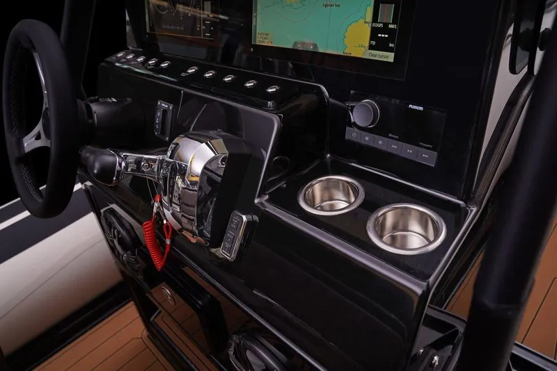 Slide: The Image of Control panel of 2027 Brig Navigator 22 boat with steering wheel and navigation display. - 8