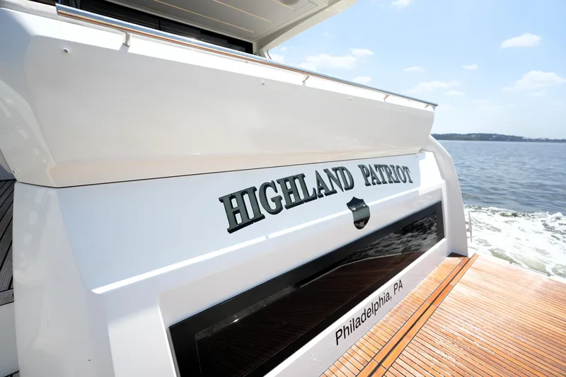 Slide: The Image of 2023 Prestige 590 yacht "Highland Patriot" cruising on open water, Philadelphia, PA. - 16