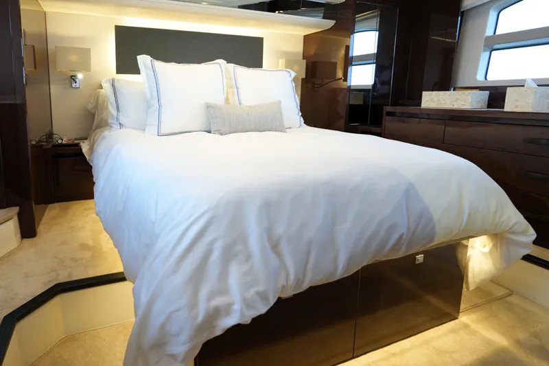 Slide: The Image of Luxurious bedroom interior of 2023 Prestige 590 yacht with elegant bedding and modern design. - 3