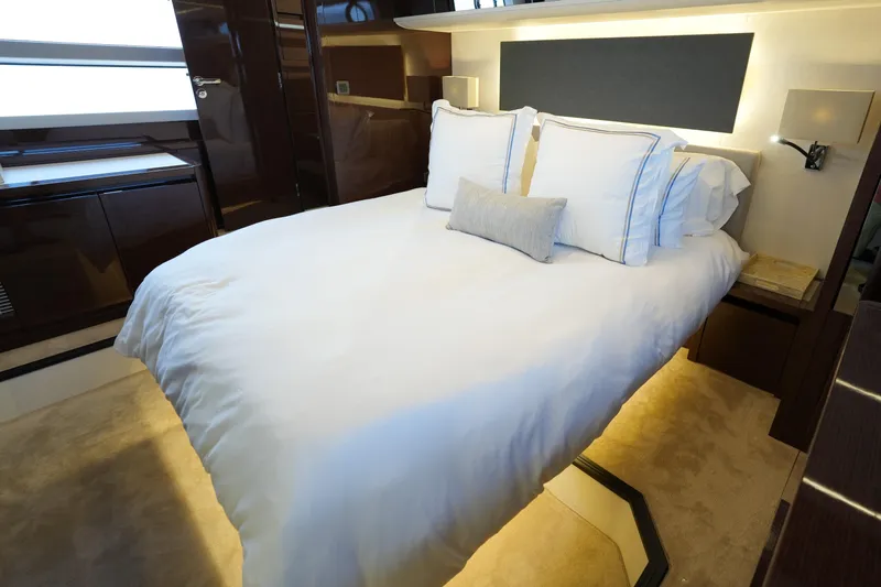 Slide: The Image of Luxurious bedroom interior of 2023 Prestige 590 yacht with elegant bedding and modern design. - 83