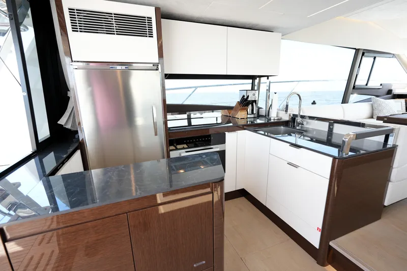 Slide: The Image of Modern kitchen interior on 2023 Prestige 590 yacht with sleek design and ocean view. - 46