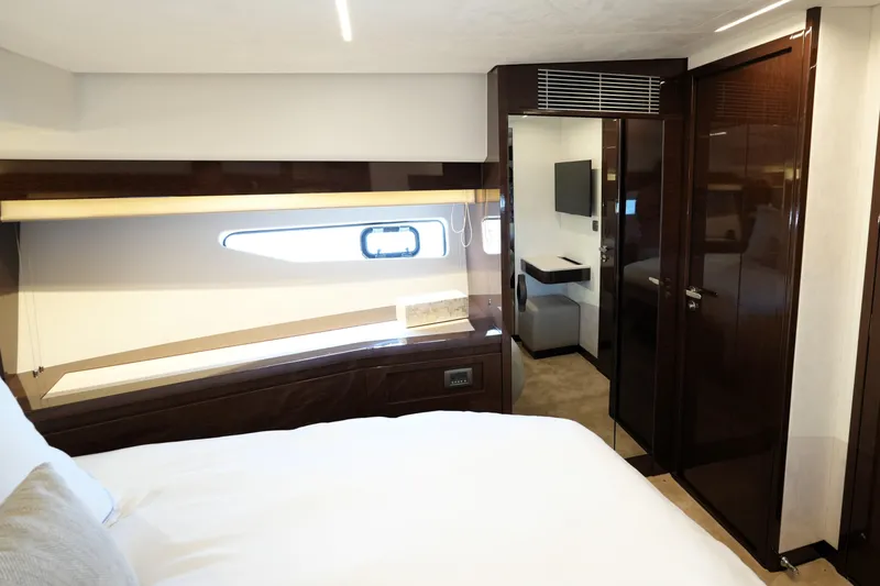 Slide: The Image of Luxurious interior of 2023 Prestige 590 yacht cabin with modern furnishings and sleek design. - 71
