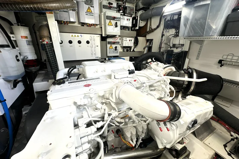 Slide: The Image of Engine room of 2023 Prestige 590 yacht, showcasing advanced machinery and control panels. - 89