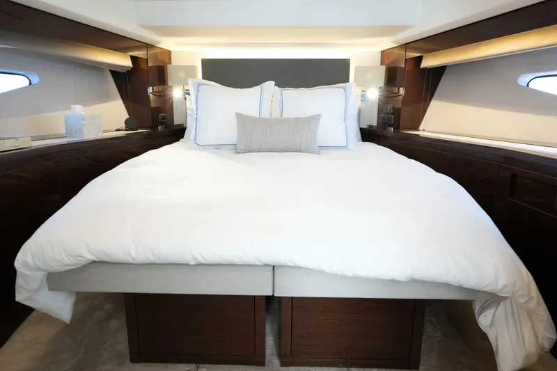 Slide: The Image of Luxurious bedroom interior of 2023 Prestige 590 yacht with elegant bedding and modern design. - 4
