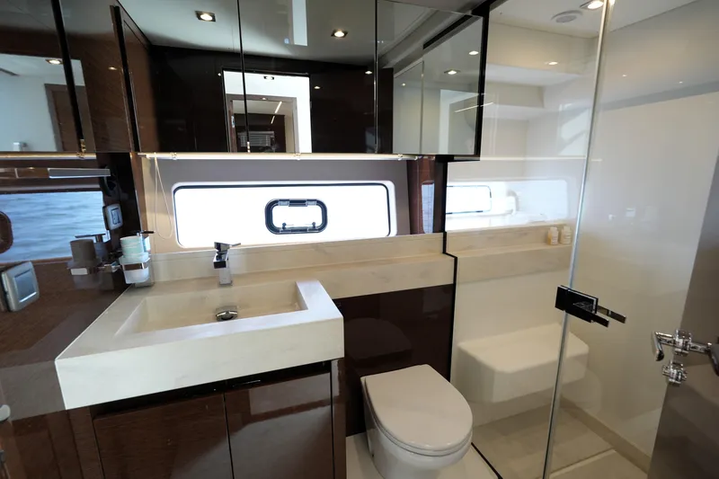 Slide: The Image of Luxurious bathroom interior of 2023 Prestige 590 yacht, featuring modern fixtures and elegant design. - 72