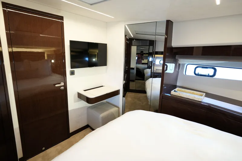 Slide: The Image of Luxurious interior of 2023 Prestige 590 yacht cabin with modern furnishings and sleek design. - 68