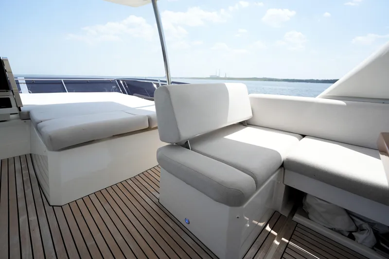 Slide: The Image of Luxurious seating area on 2023 Prestige 590 yacht with ocean view. - 33