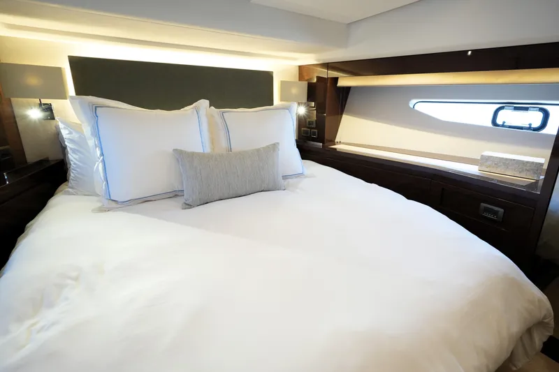 Slide: The Image of Luxurious bedroom interior of 2023 Prestige 590 yacht with elegant bedding and modern design. - 70