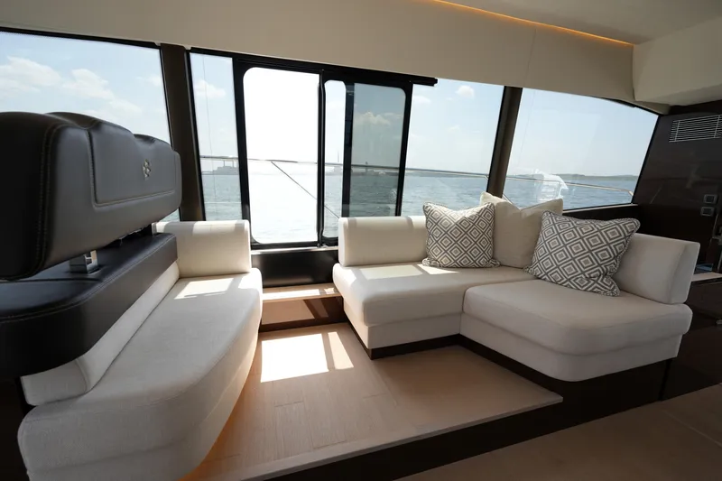 Slide: The Image of Luxurious interior of 2023 Prestige 590 yacht with elegant seating and ocean view. - 58