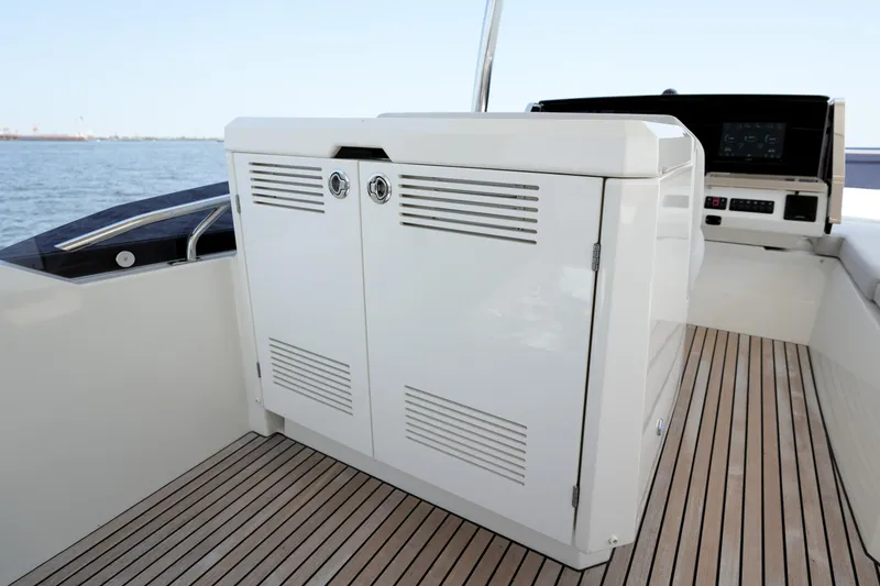 Slide: The Image of Modern 2023 Prestige 590 yacht interior with sleek cabinetry and wooden flooring. - 41