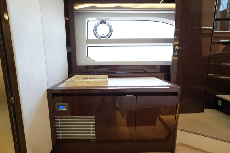 Slide: The Image of Luxurious interior of 2023 Prestige 590 yacht with sleek cabinetry and modern design. - 82
