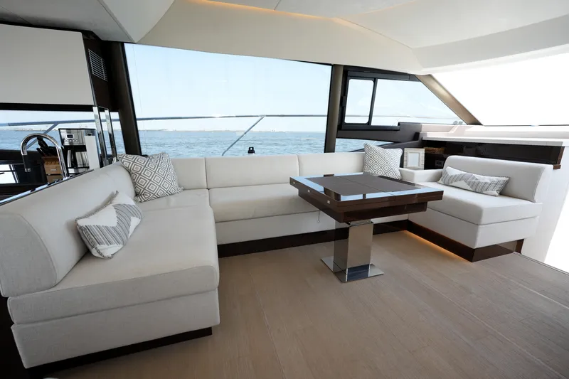 Slide: The Image of Luxurious interior of 2023 Prestige 590 yacht with elegant seating and ocean view. - 55
