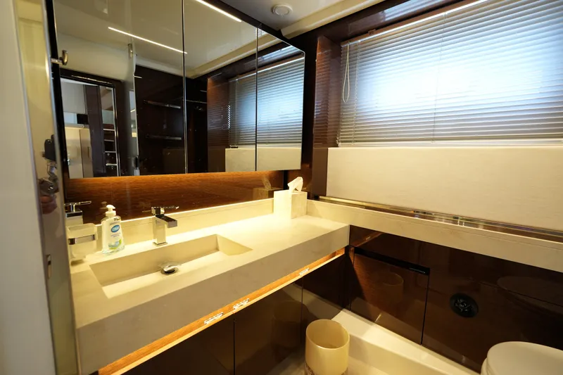 Slide: The Image of Luxurious bathroom interior on a 2023 Prestige 590 yacht, featuring modern fixtures and elegant design. - 87