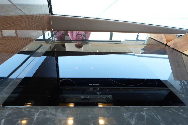 Slide: The Image of Modern kitchen with Siemens induction cooktop on Prestige 590 yacht, 2023 model. - 51