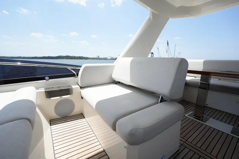 Slide: The Image of Luxurious seating area on 2023 Prestige 590 yacht with scenic ocean view. - 34