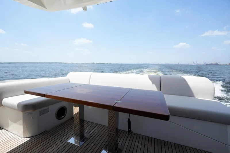 Slide: The Image of Luxury seating area on 2023 Prestige 590 yacht with ocean view. - 19