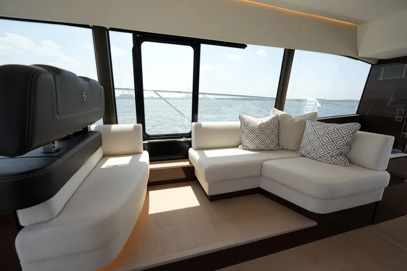 Slide: The Image of Luxurious interior of 2023 Prestige 590 yacht with elegant seating and ocean view. - 57