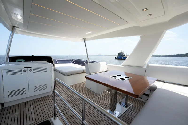 Slide: The Image of Luxurious 2023 Prestige 590 yacht interior with elegant seating and ocean view. - 31