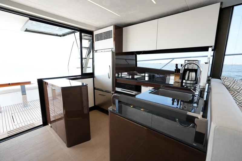 Slide: The Image of Luxurious kitchen interior on 2023 Prestige 590 yacht with modern appliances and ocean view. - 47