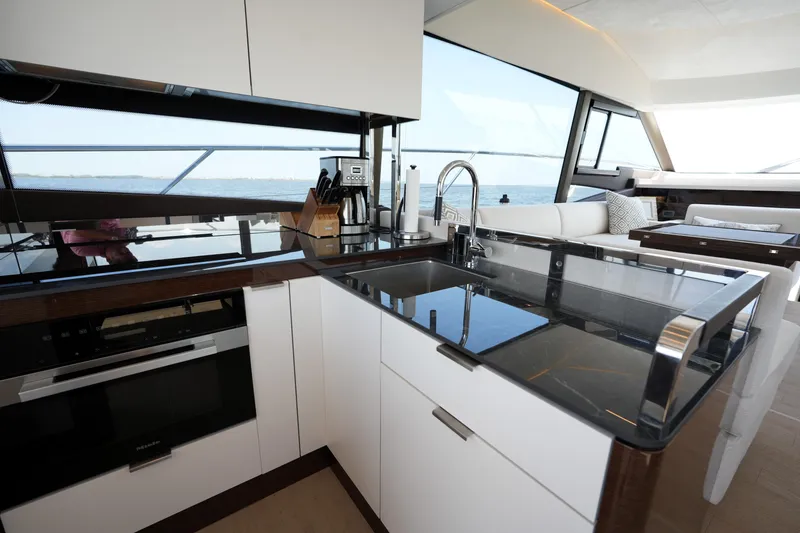 Slide: The Image of Modern kitchen interior on 2023 Prestige 590 yacht with ocean view. - 48